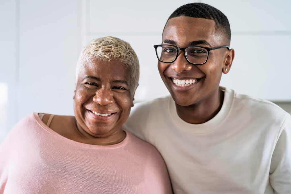 Happy smiling mother and son portrait - Family love and unity concept