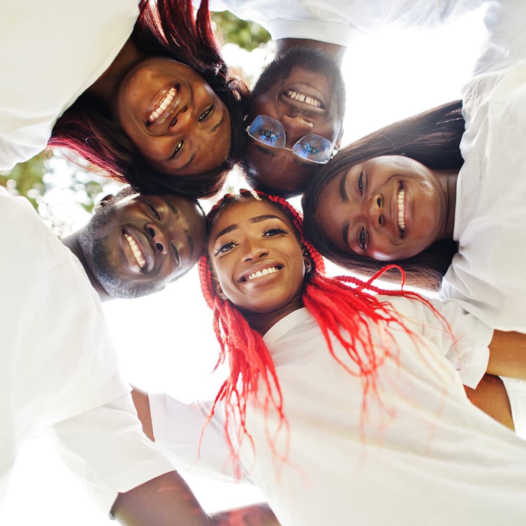Group of African American teen standing in a circle